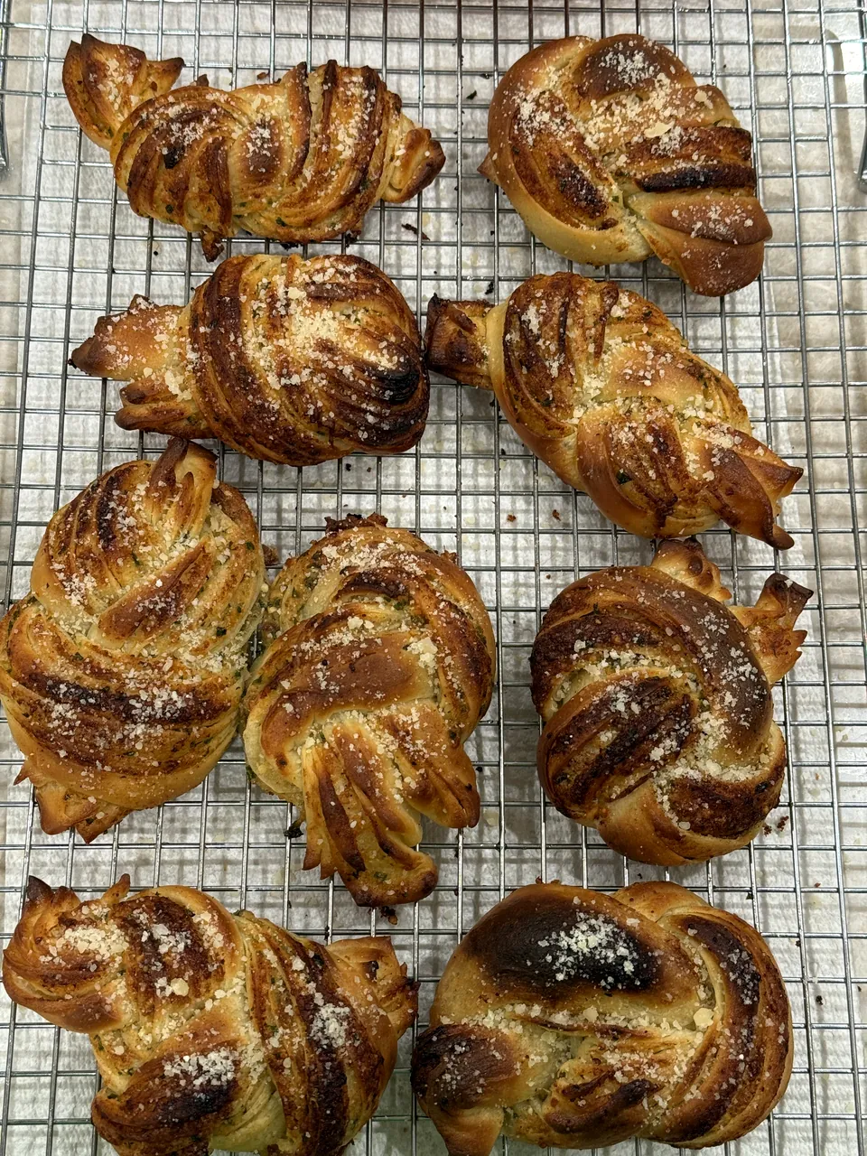 Knotted buns cooling on a rack